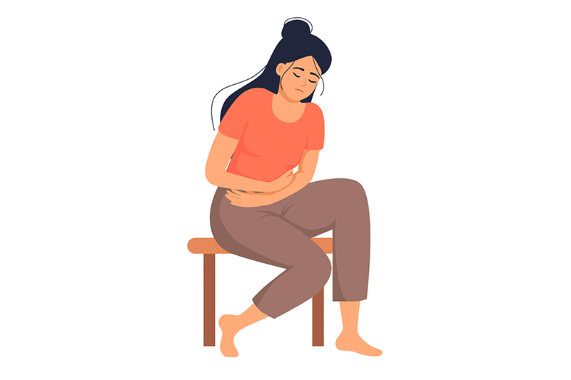 Ilustração de mulher de cabelos longos e escuros sentada em um banco com as mãos sobre a barriga, sinalizando dor pélvica